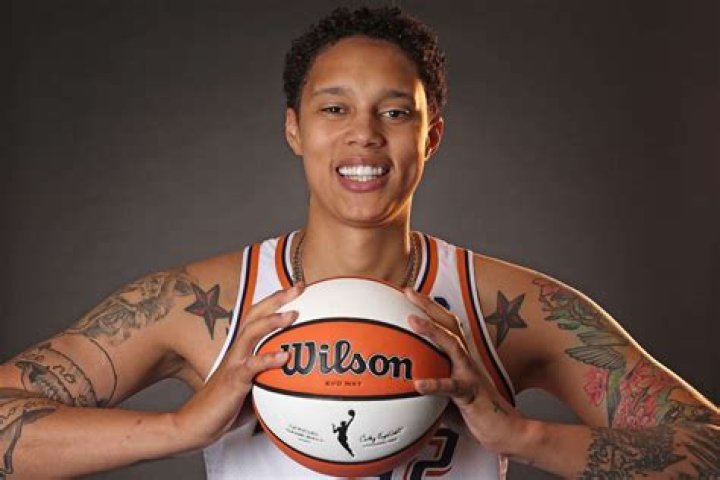 Brittney Griner is on the court and smiling as she gets ready for her