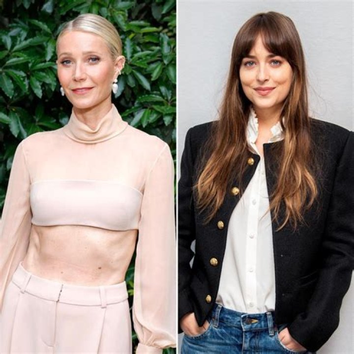 Dakota Johnson, 29, holds hands with younger sister Grace, 19, as they