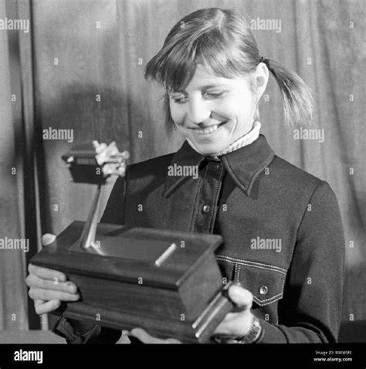 Three time world champion Olga Korbut handling BBC prize given to the